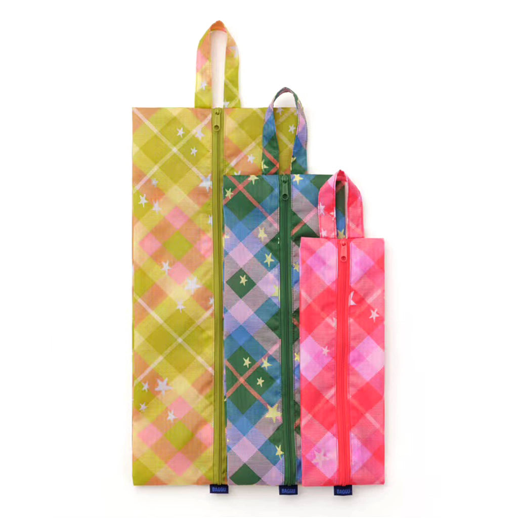 Baggu 3D Zip Bags in Star Plaid prints, flat and stacked on a white background.