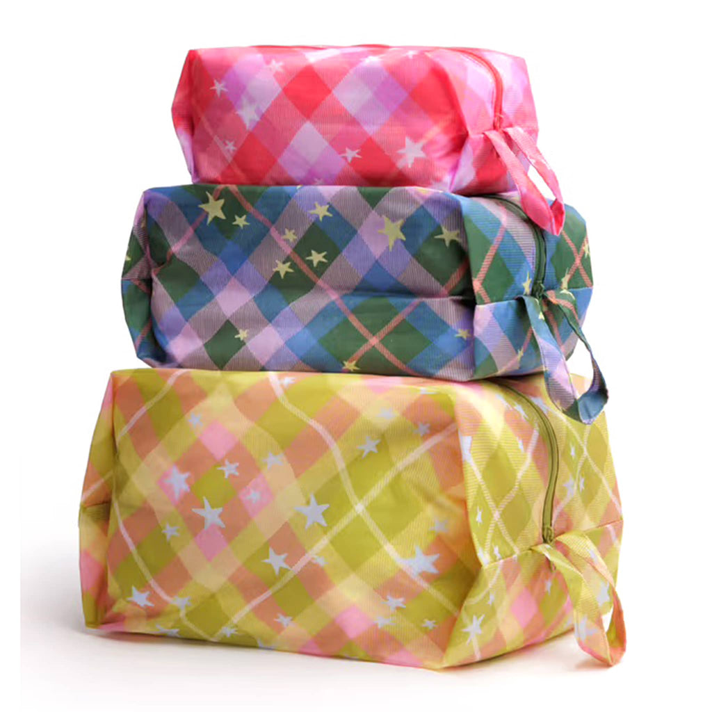 Baggu 3D Zip Bags in Star Plaid prints, stuffed and stacked on a white background.