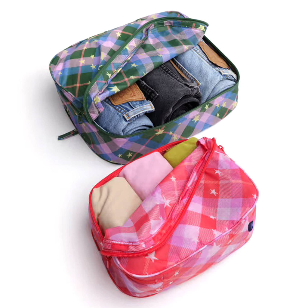 Baggu Star Plaid reusable recycled nylon packing cubes, set of two, unzipped with clothes inside.