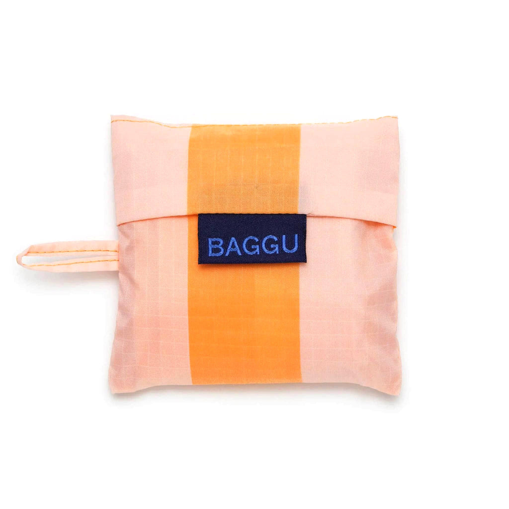 Baggu baby size eco-friendly recycled ripstop nylon reusable tote bag in Tangerine Wide Stripe, in matching pouch.