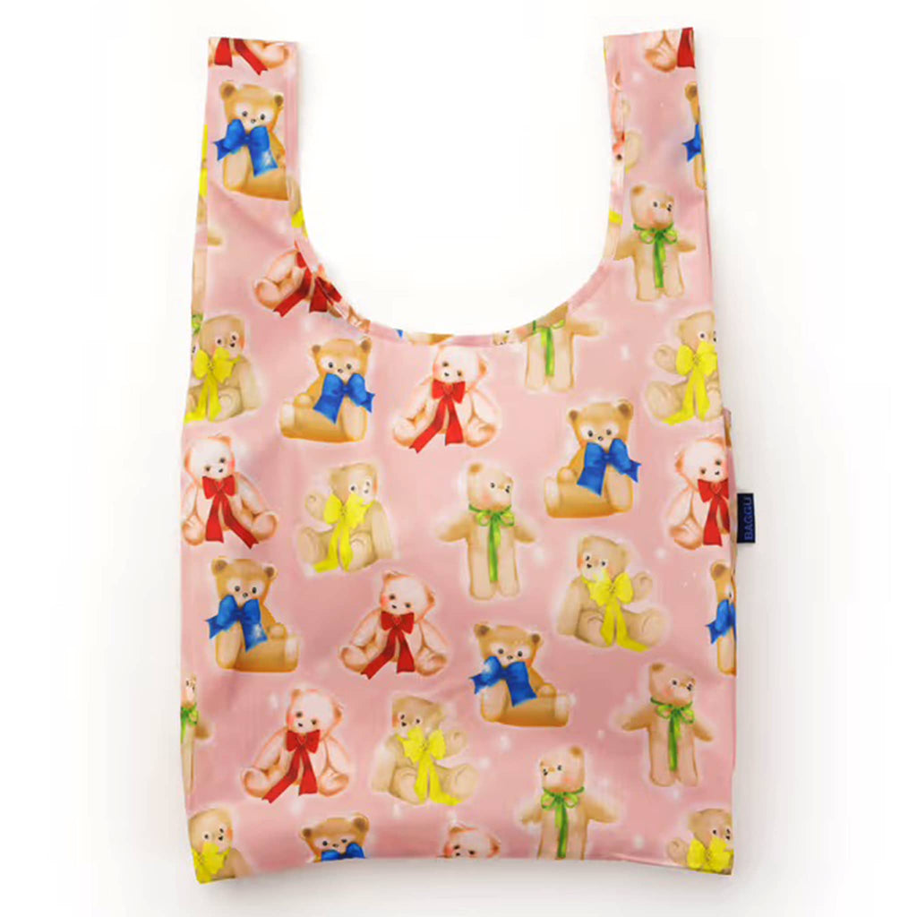 Reusable shopping bag with teddy bear pattern on a pink background.