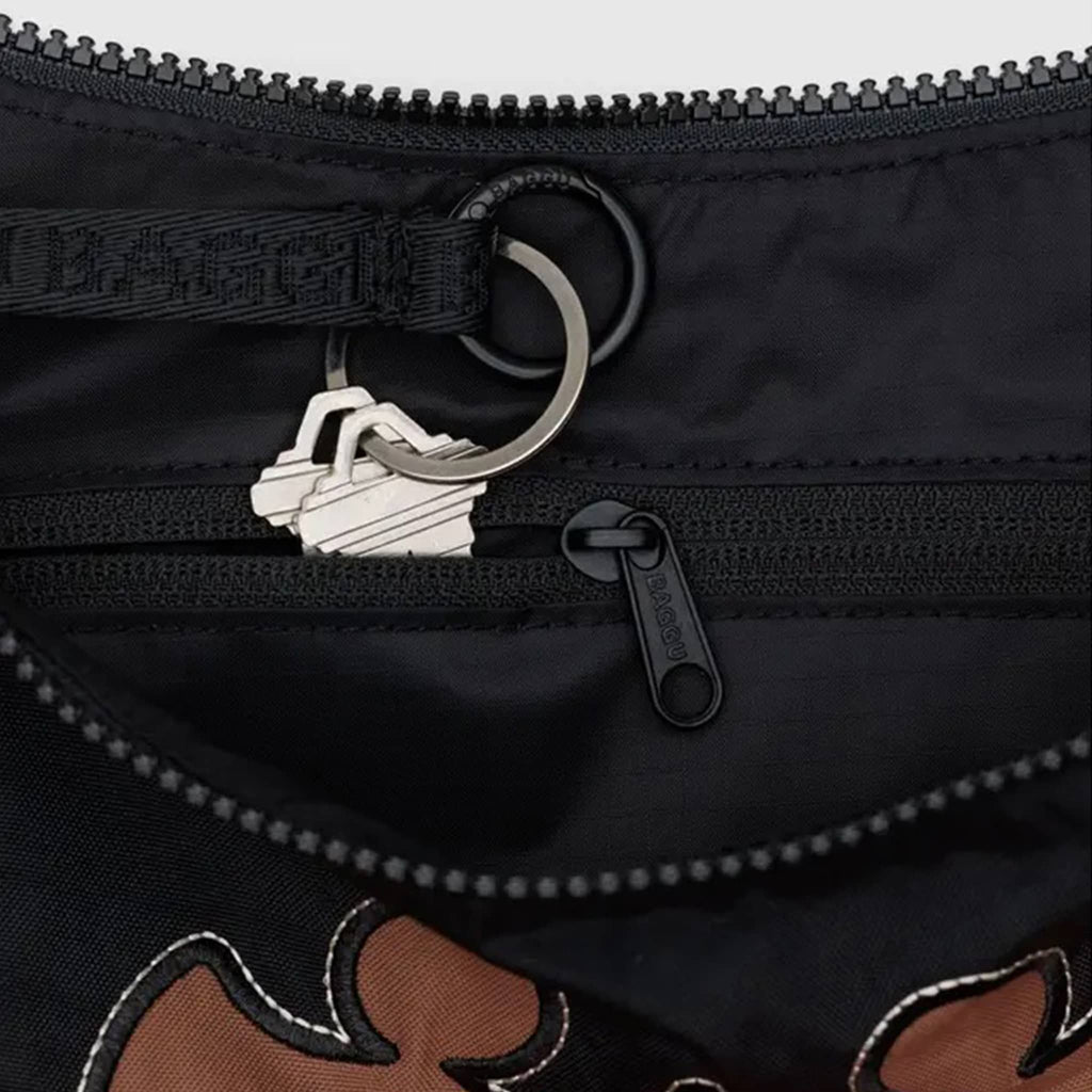 Baggu Western Applique medium ripstop nylon crescent bag, detail of key ring and interior zip pocket.