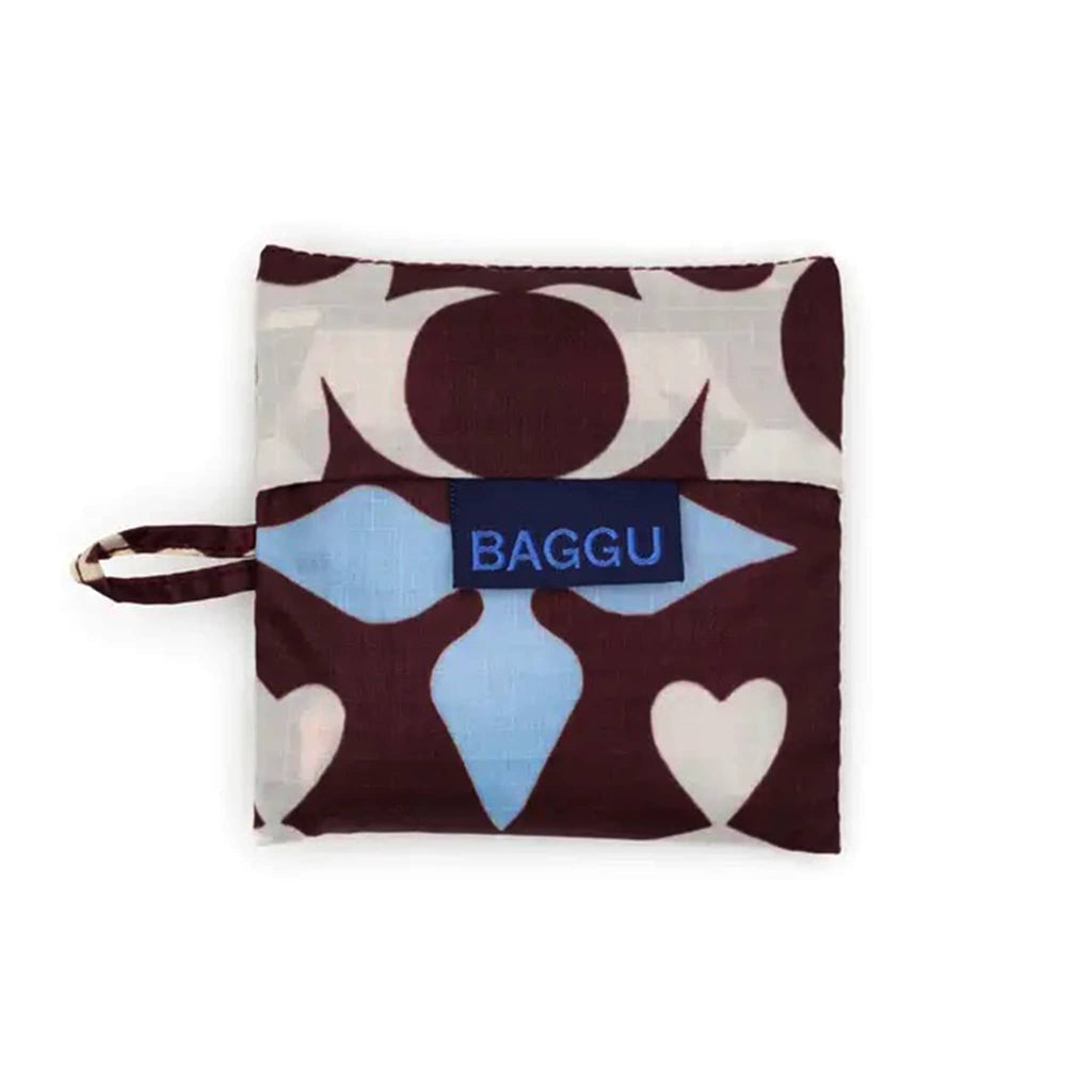Foldable shopping bag with geometric pattern in matching pouch with 'BAGGU' logo on a white background.