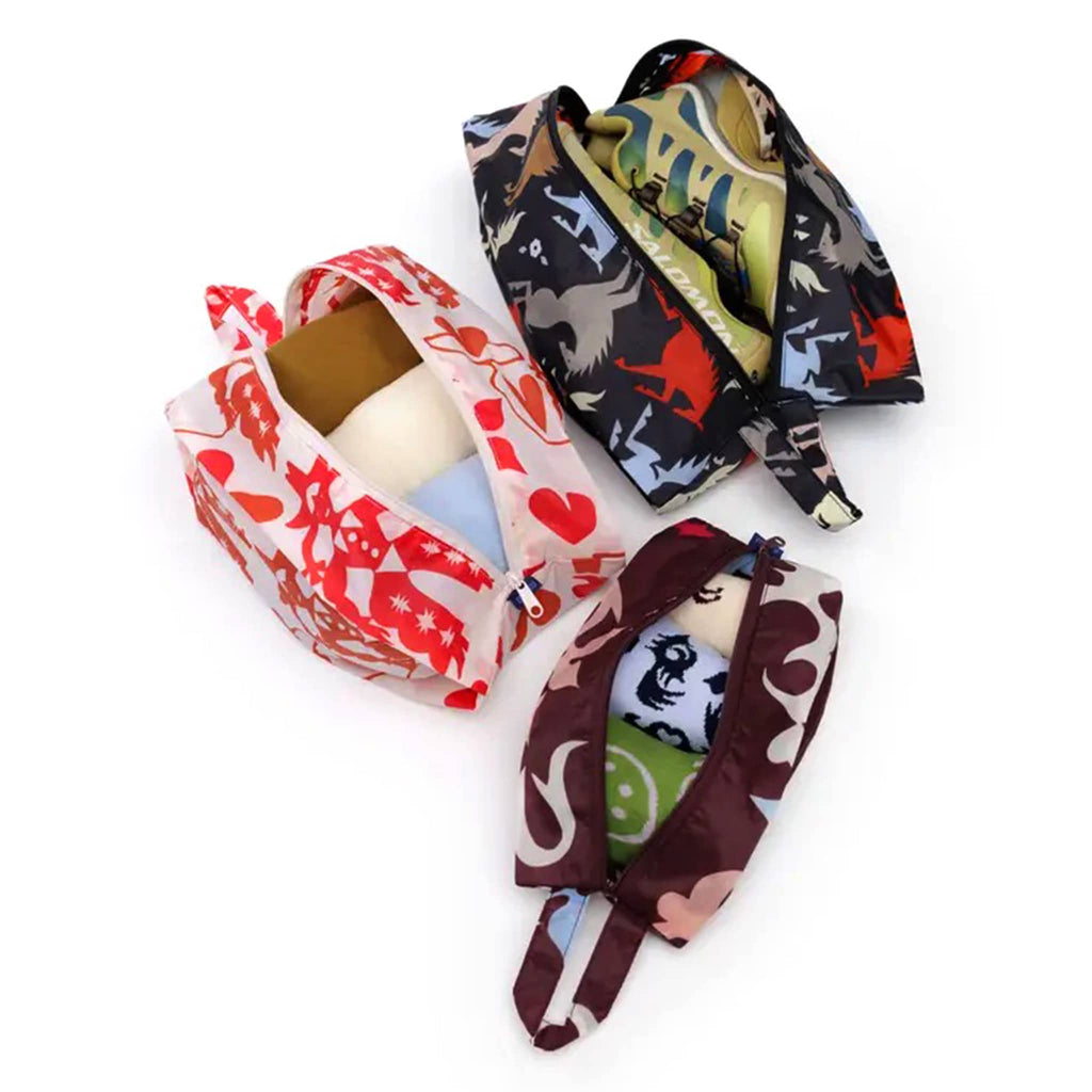 Baggu Western Cut Outs reusable recycled nylon 3d zip set bags, set of 3 in different prints, overhead view, stuffed with clothes and open.