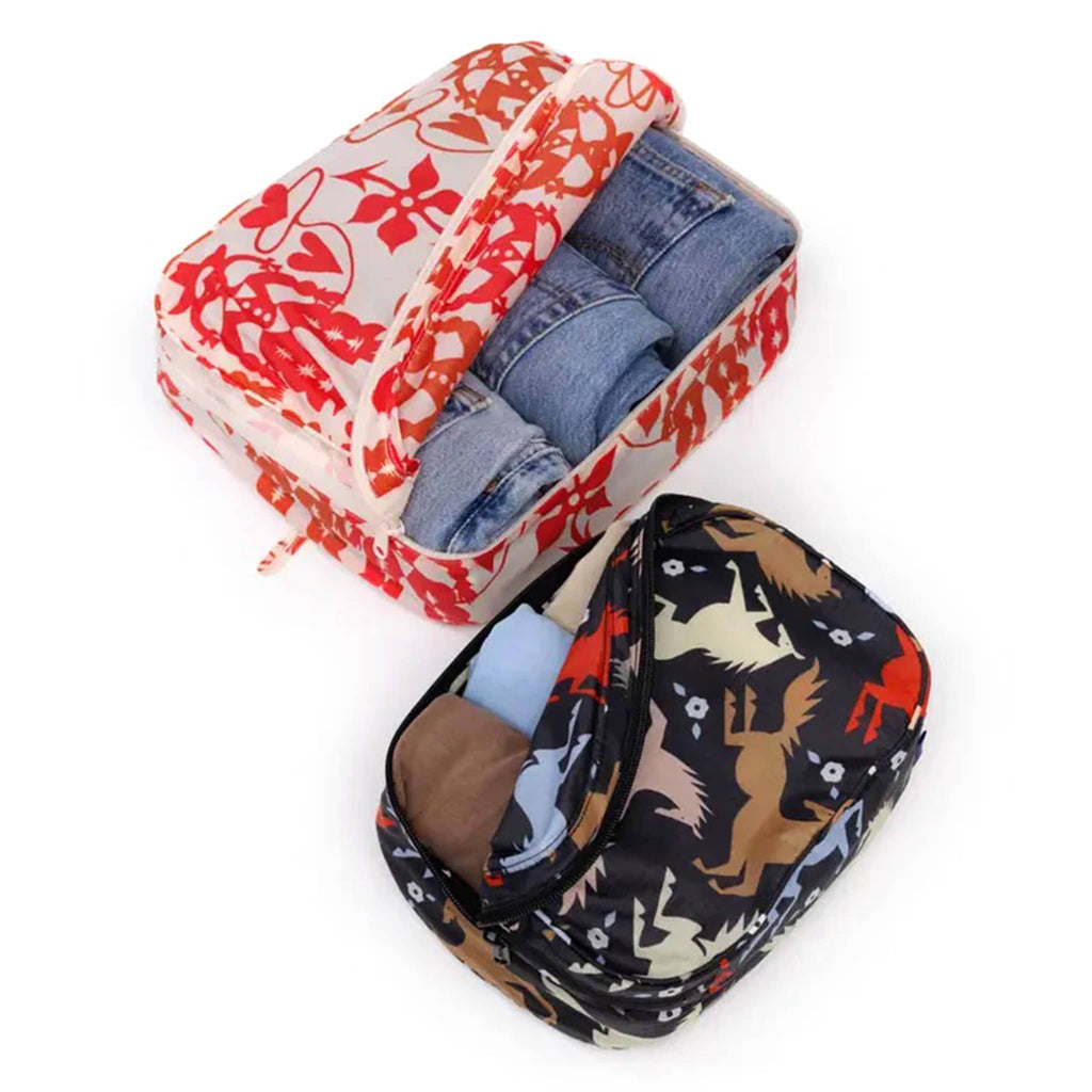 Baggu Western Cut Outs reusable recycled nylon packing cubes, set of two, open with clothing inside.