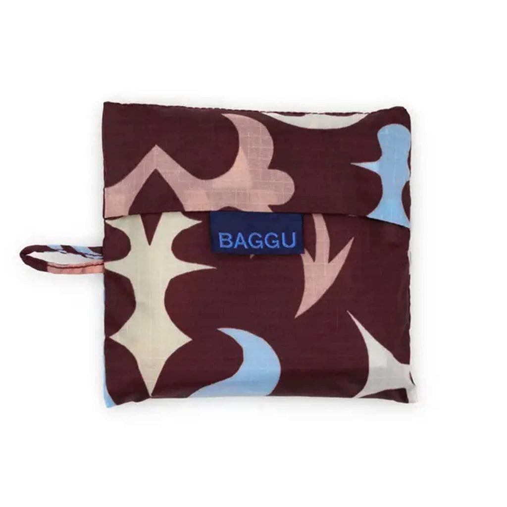Foldable shopping bag with abstract pattern and 'BAGGU' branding in matching pouch on a white background.