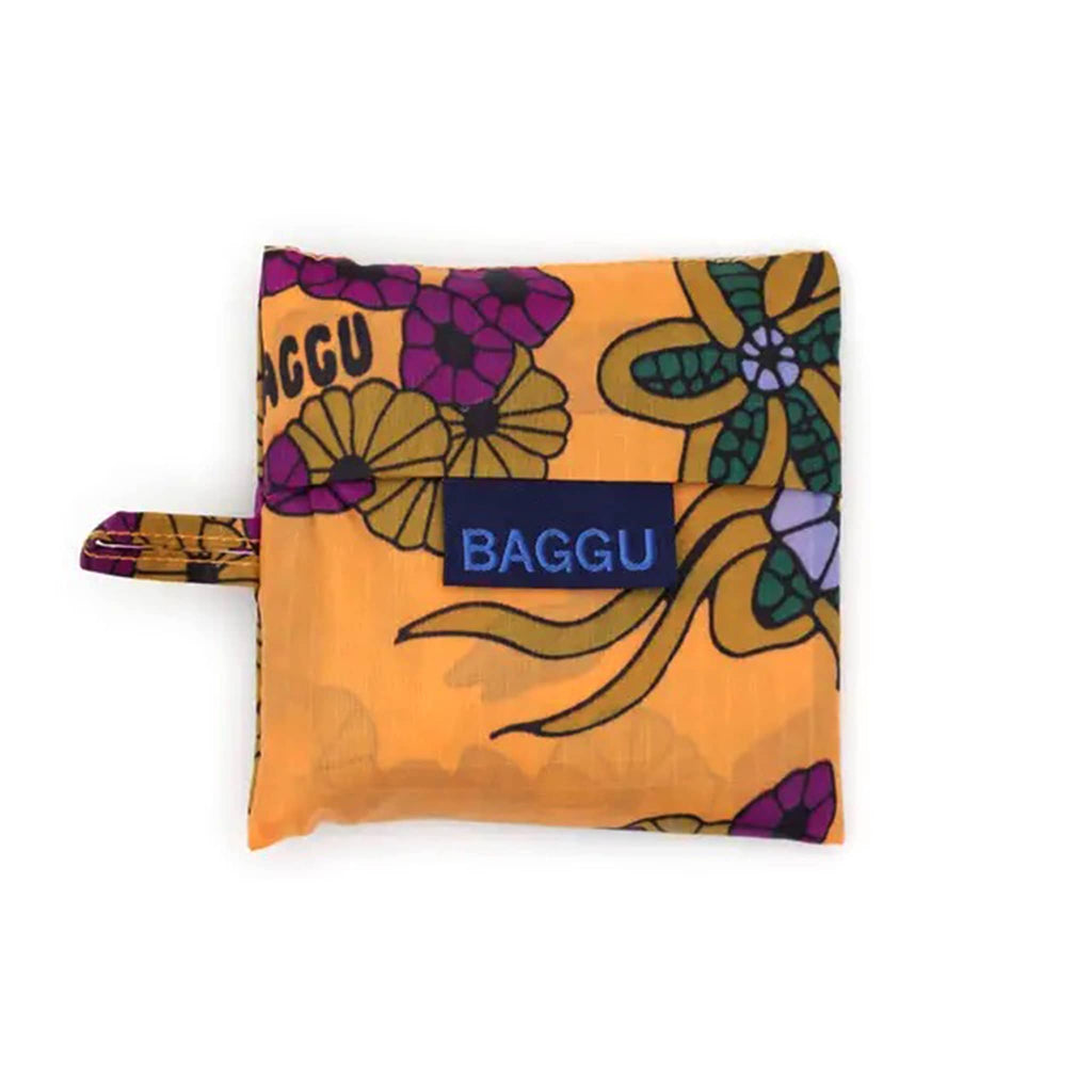 Floral-patterned reusable bag in matching pouch with 'BAGGU' branding on a white background.