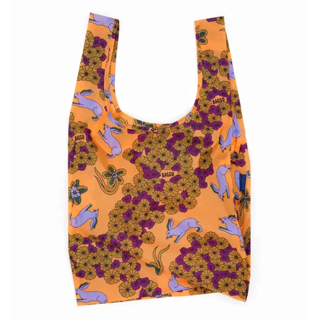 Reusable bag with floral and animal pattern on an orange background