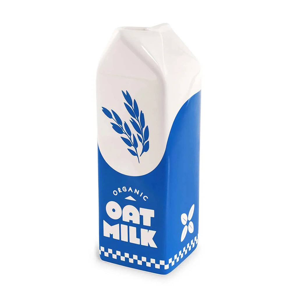 Ban.do blue and white porcelain vase that looks like a carton of oat milk, front angle view.