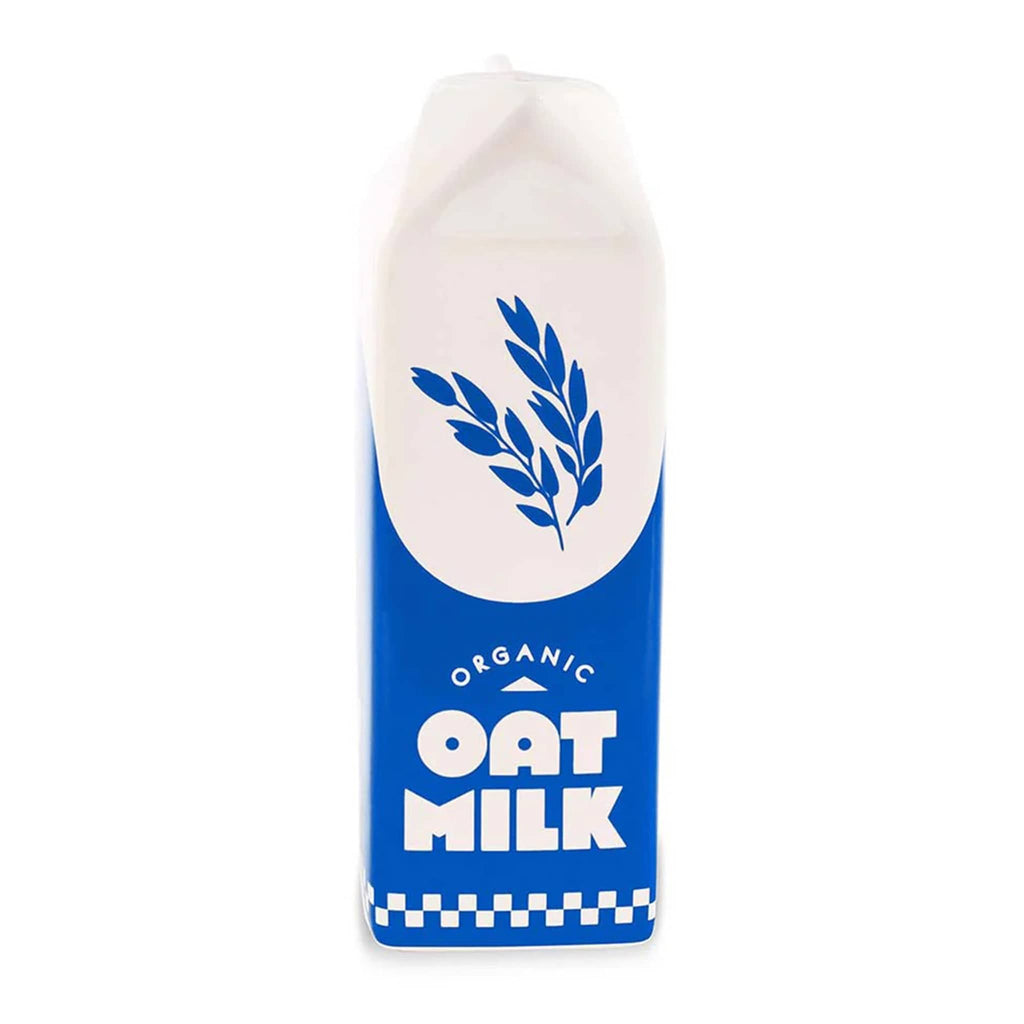 Ban.do blue and white porcelain vase that looks like a carton of oat milk, front view.