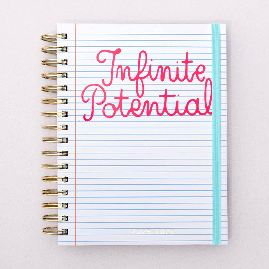 Planner with 'Infinite Potential' text on a white ruled background on the front cover.