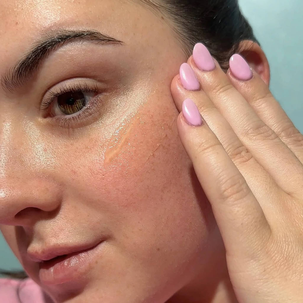 Bask 40 SPF Daily Invisible Gel broad-spectrum sunscreen being applied on a woman's face.