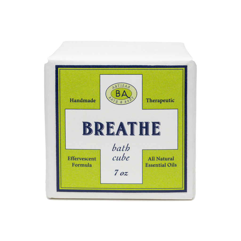 Baudelaire Breathe therapeutic, effervescent bath cube in white paper wrapping with lime green label, front view.
