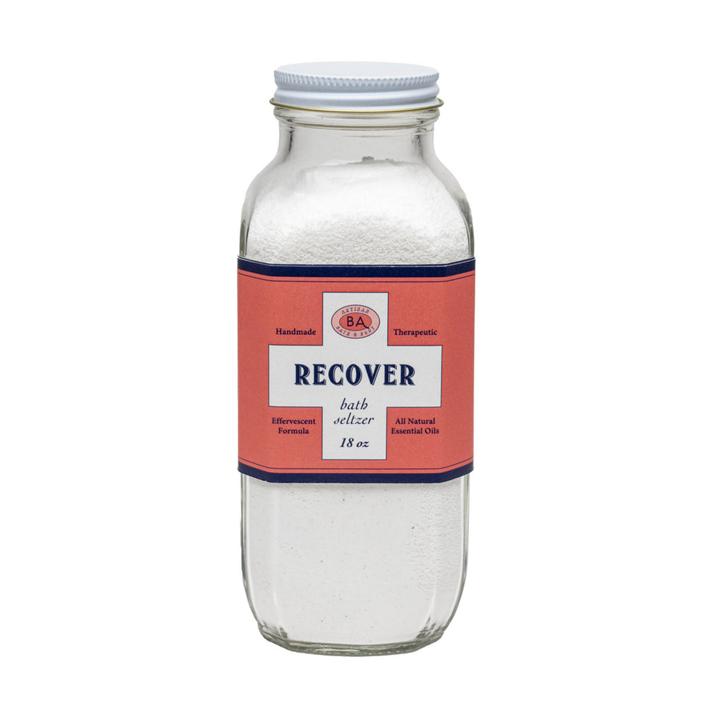 Baudelaire Recover therapeutic, effervescent bath seltzer salts in clear glass bottle with orange label, front view.