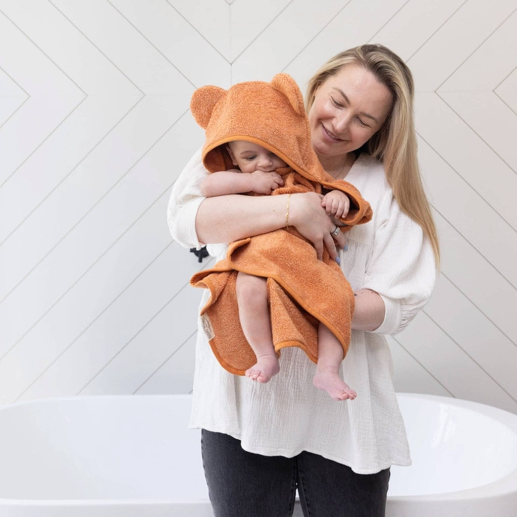 Bella Tunno Baby Hooded Bath Towel and Wash Mitt Set in Pumpkin, on baby.