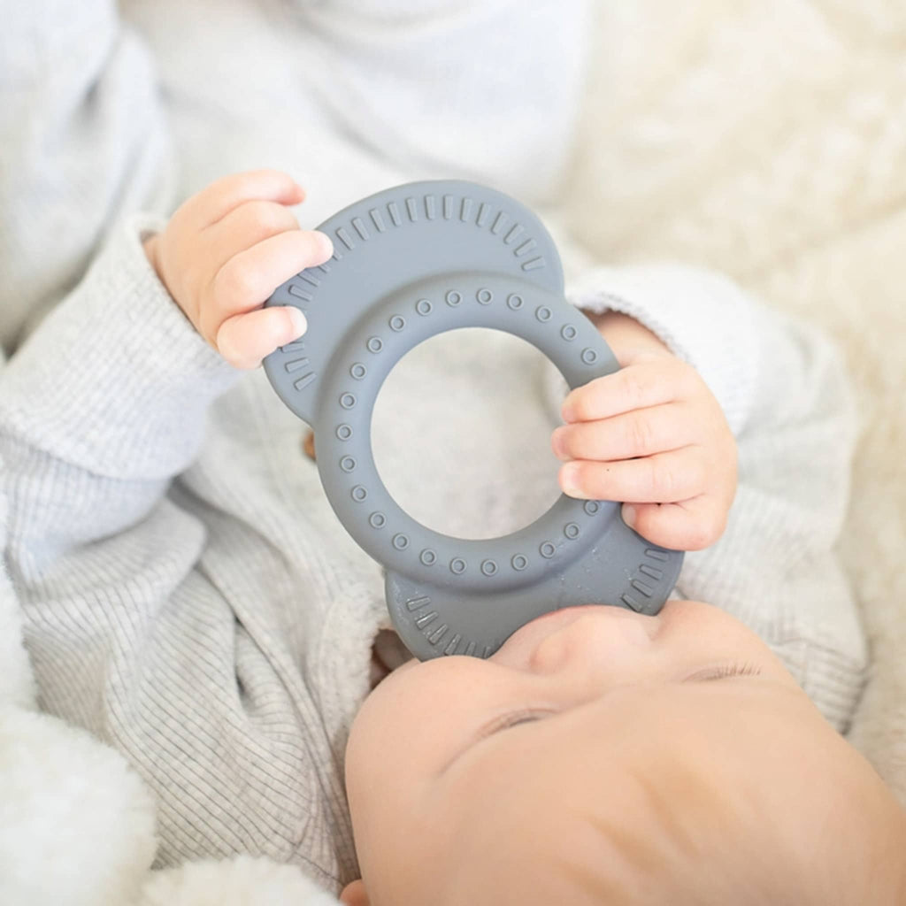 Bella Tunno Gray Elephant Silicone Baby Rattle Teether, with baby.