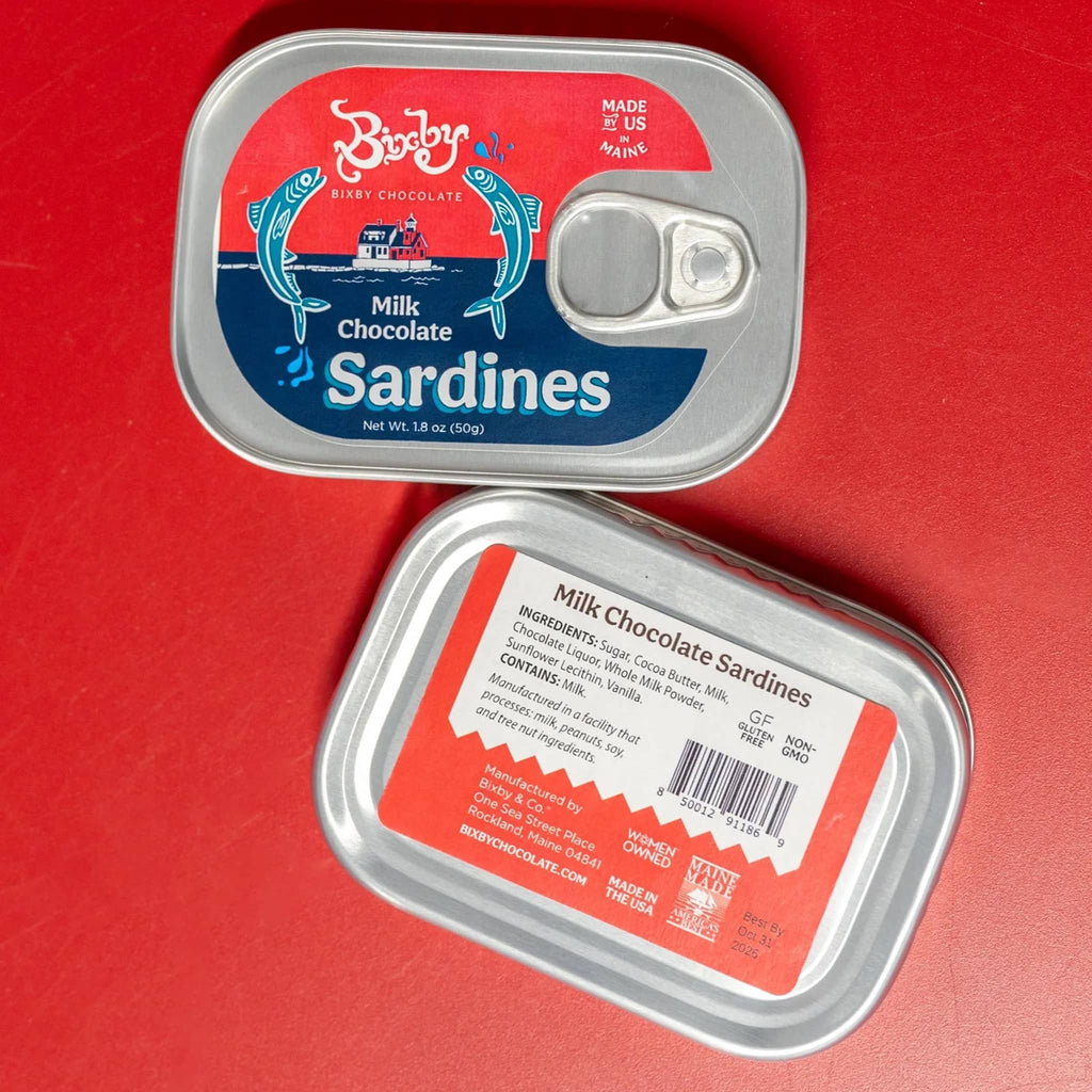 Bixby Milk Chocolate Sardines in vintage-style tin, front and back view on red background.