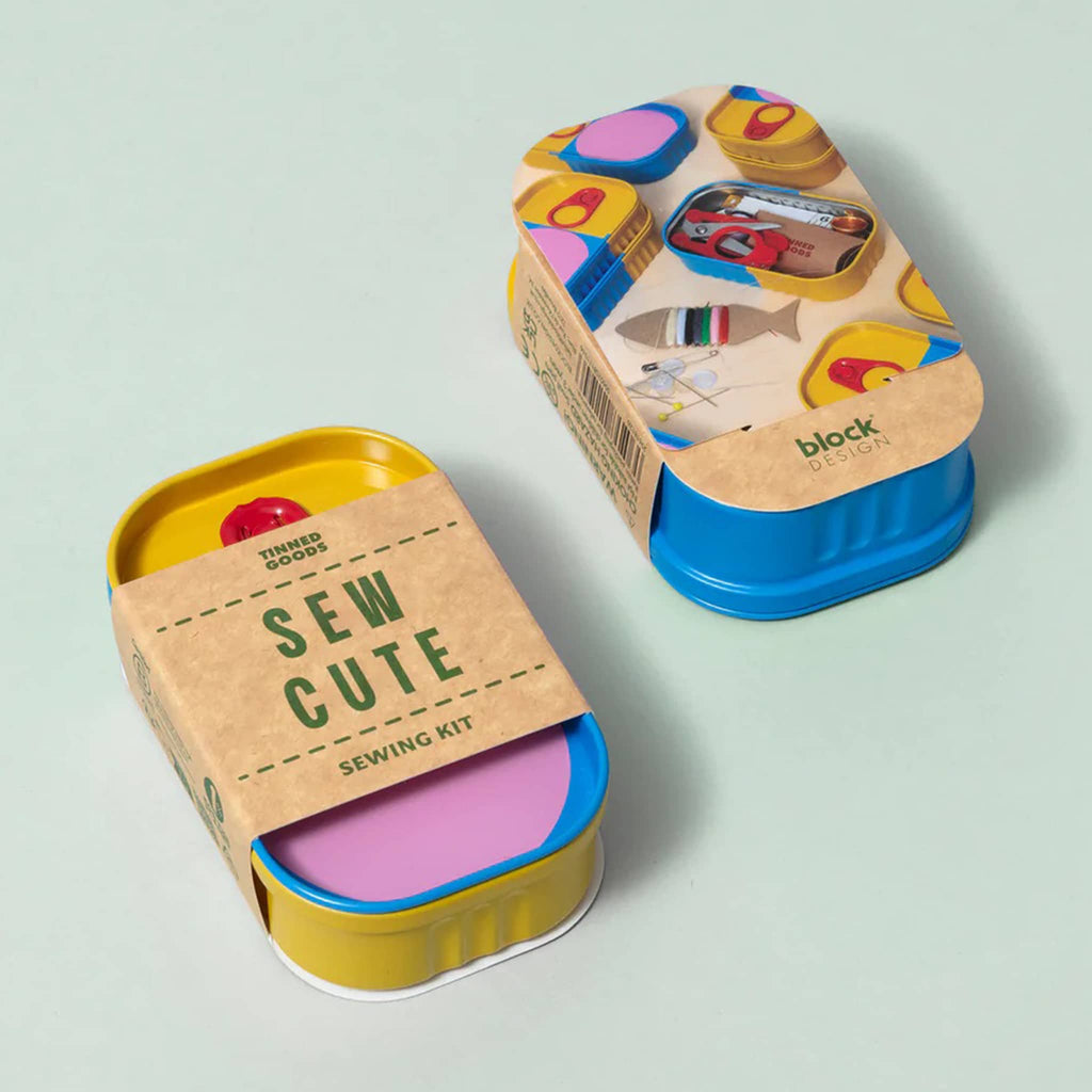 Sewing kit in colorful tin packaging, top and bottom shown, on a light green background.