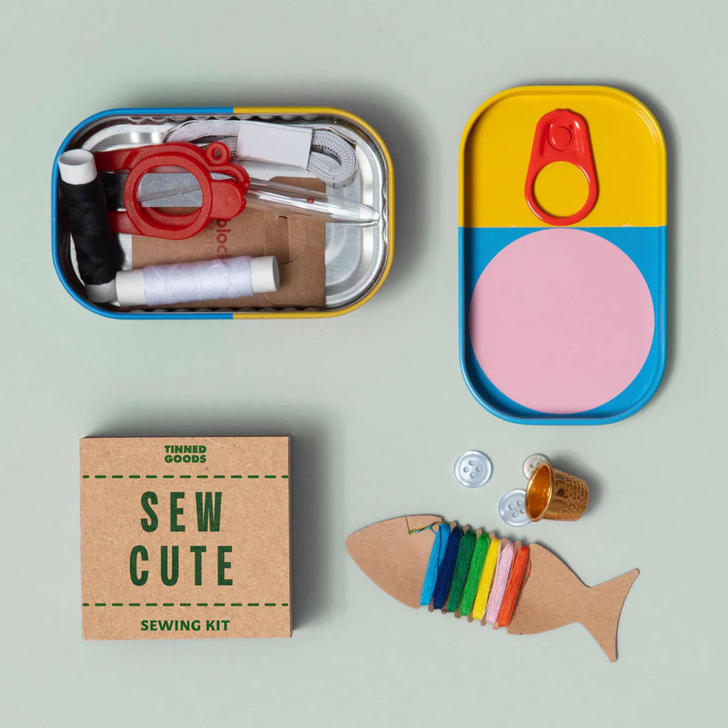 Sew Cute sewing kit with colorful tin packaging on a light green background.
