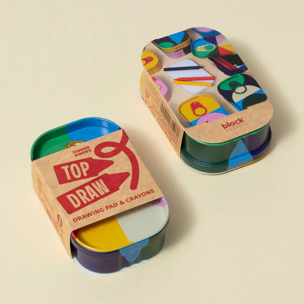 Colorful drawing pad and crayons set in a tin with 'Top Draw' branding, top and bottom shown, on a beige background.