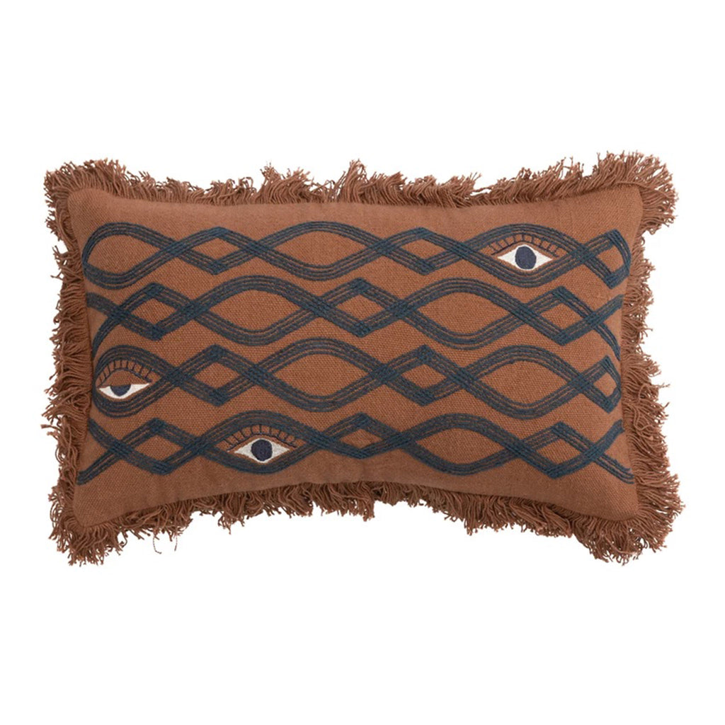 Bloomingvile brown cotton lumbar pillow with brown thread fringe on all sides and navy blue embroidered lines and eyes.