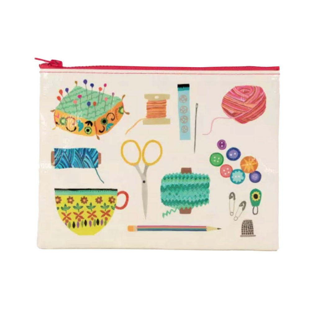 Blue Q recycled plastic zipper pouch in cream with colorful illustrations of sewing kit items on the front and back and a red zipper at the top.