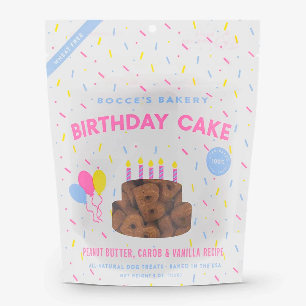 Bocce's Bakery Birthday Cake peanut butter molasses and vanilla all natural crunchy dog biscuit treats in white pouch packaging with yellow, pink and blue confetti sprinkles, front view.