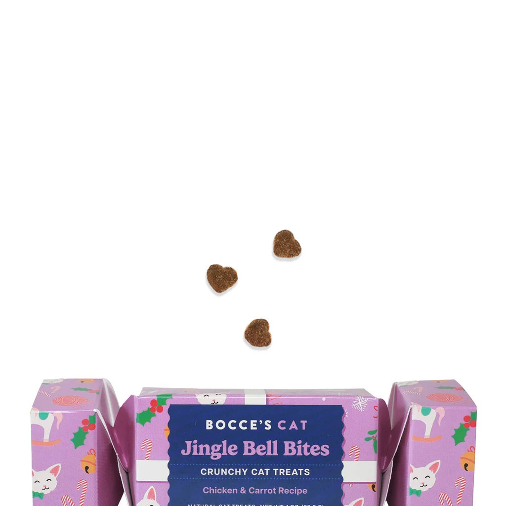 Bocce's Bakery Jingle Bell Bites all natural crunchy cat treats in holiday cracker packaging, with 3 heart-shaped treats for scale.