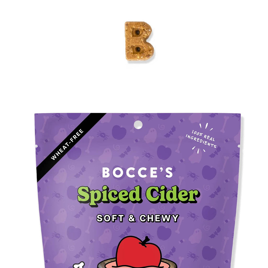 Purple package of Bocce's Spiced Cider soft and chewy dog treats with a B-shaped treat on a white background.