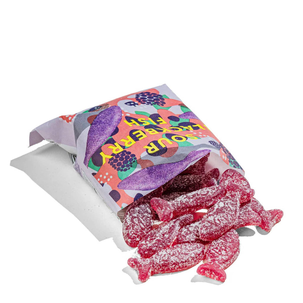 BonBon NYC Sour Blackberry Fish swedish gummy candy in purple packaging, sour sugar-coated purple fish candies spilling out of open package.