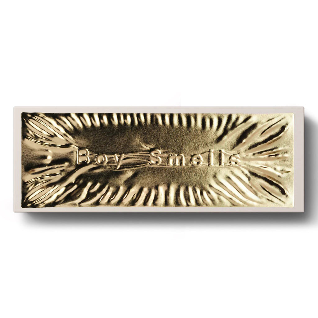 Boy Smells 2023 Limited Edition Holiday scented coconut beeswax votive candle set in tan gift box packaging with a shiny gold label embossed with "boy smells."