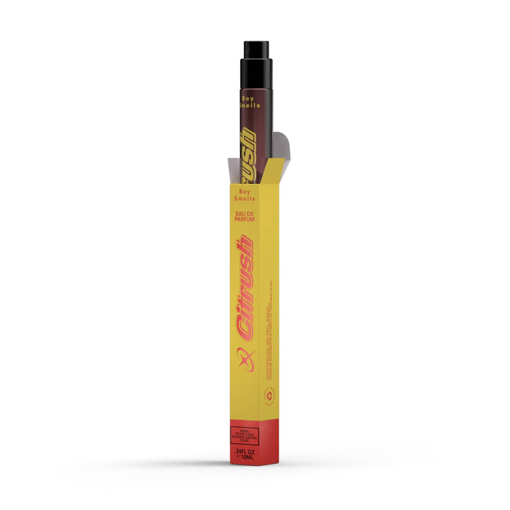 Boy Smells Citrush scented eau de parfum travel spray bottle coming out of box packaging, front angle view.