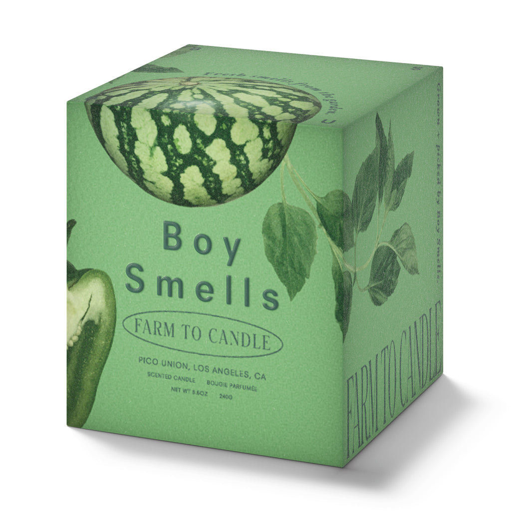 Boy Smells Rinder scented candle from the Farm to Candle Collection in illustrated green gift box, front and side angle.