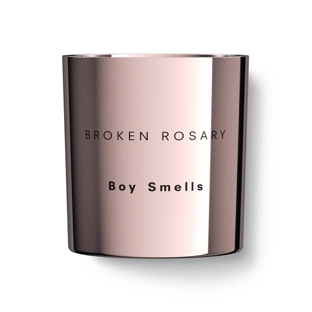 Boy Smells 2024 Limited Edition Holiday Broken Rosary scented coconut beeswax blend candle in metallic pink glass tumbler with "broken rosary" and "boy smells" engraved on the front.