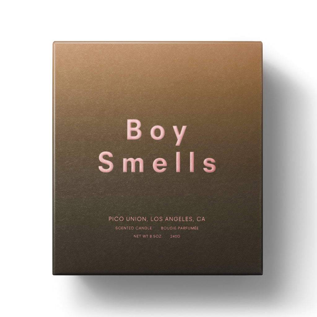 Boy Smells Mandarin Fantome scented coconut and beeswax blend candle in ombre matte orange box packaging with pink embossed lettering.