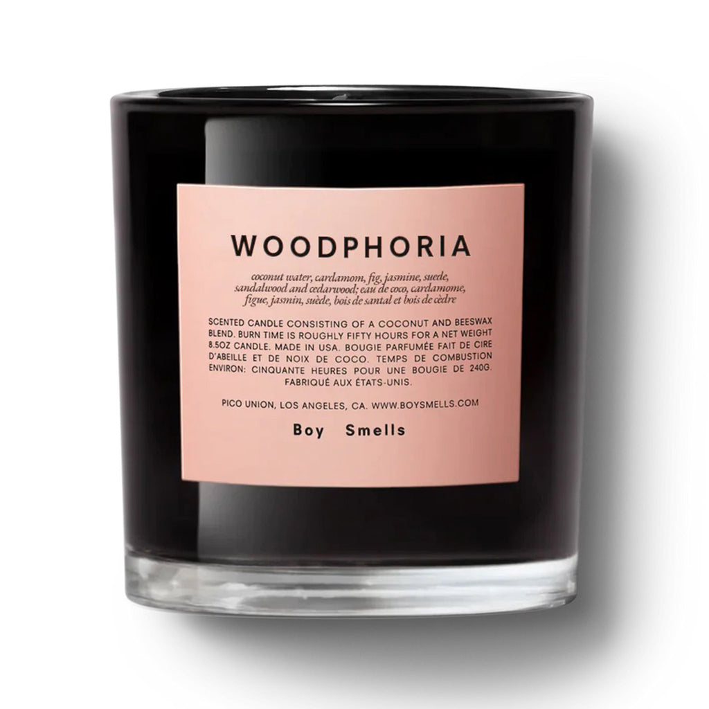 Boy Smells Woodphoria scented coconut and beeswax blend candle in glossy black glass tumbler with matte pink label, front view.