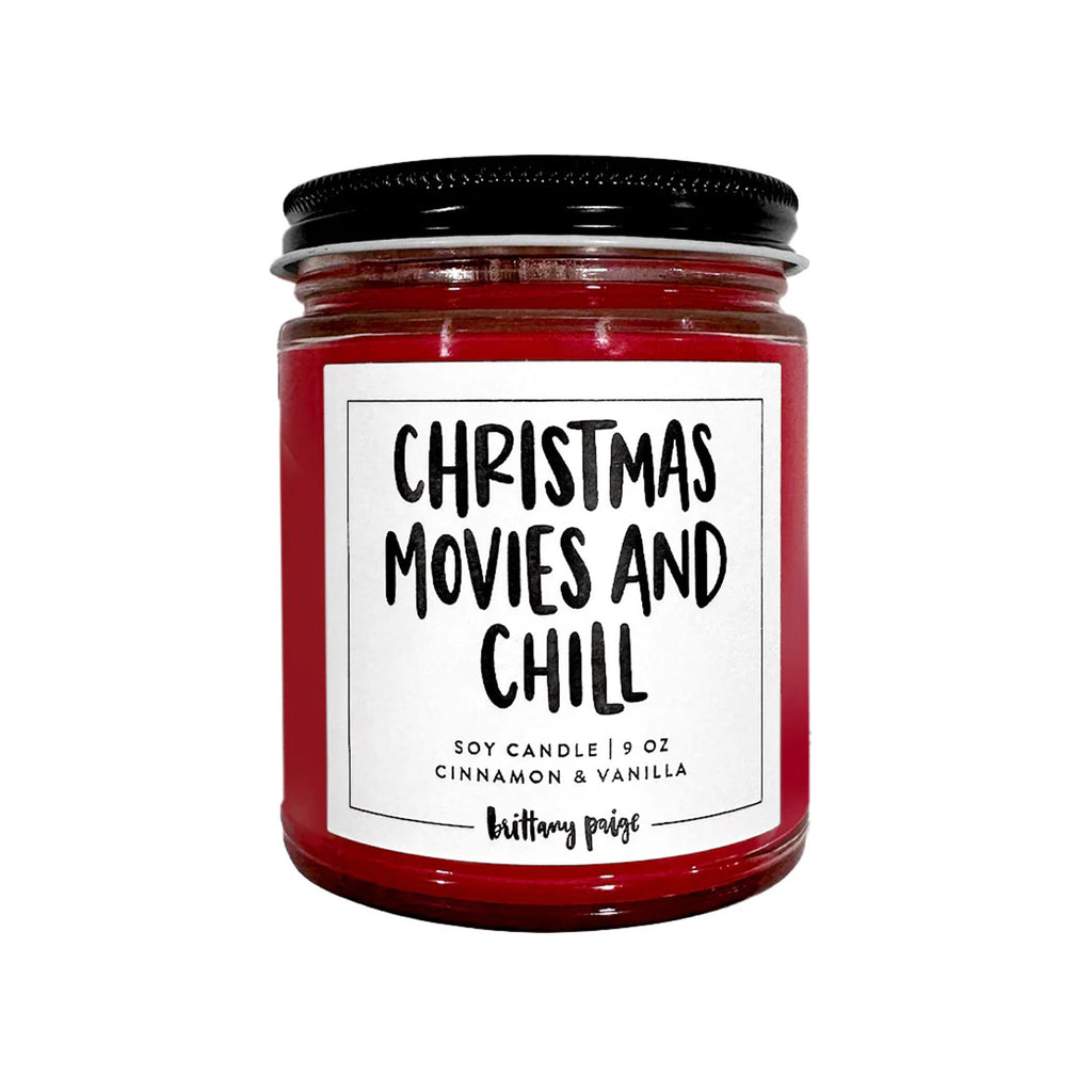 Brittany Paige Christmas Movies and Chill Cinnamon and Vanilla scented soy wax candle in clear glass jar with a black lid and white label.