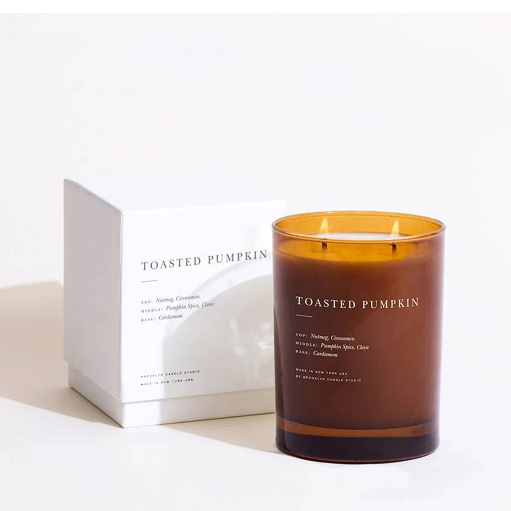 Toasted Pumpkin candle with packaging on a white background.