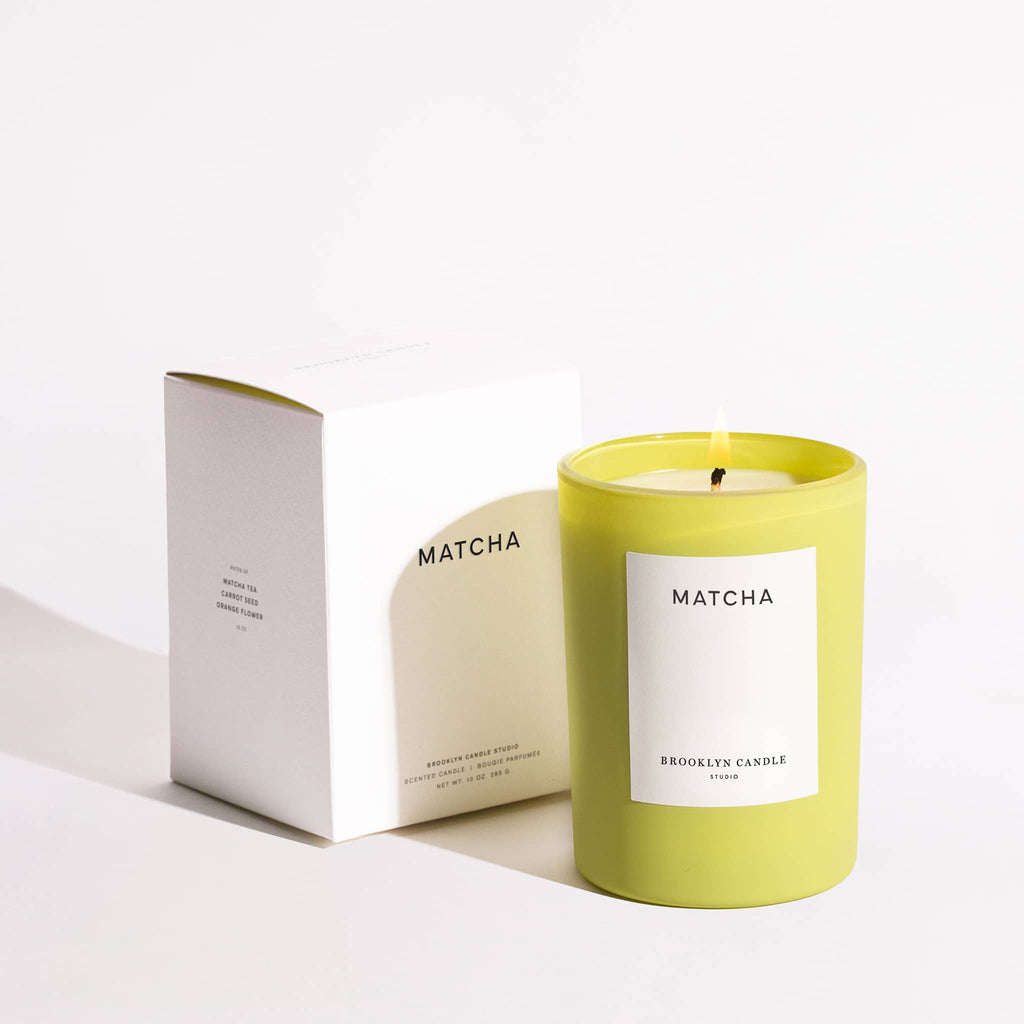 Brooklyn Candle Studio Limited Edition Herbarium Summer Collection, Matcha scented soy wax candle in chartreuse glass vessel with white gift box.