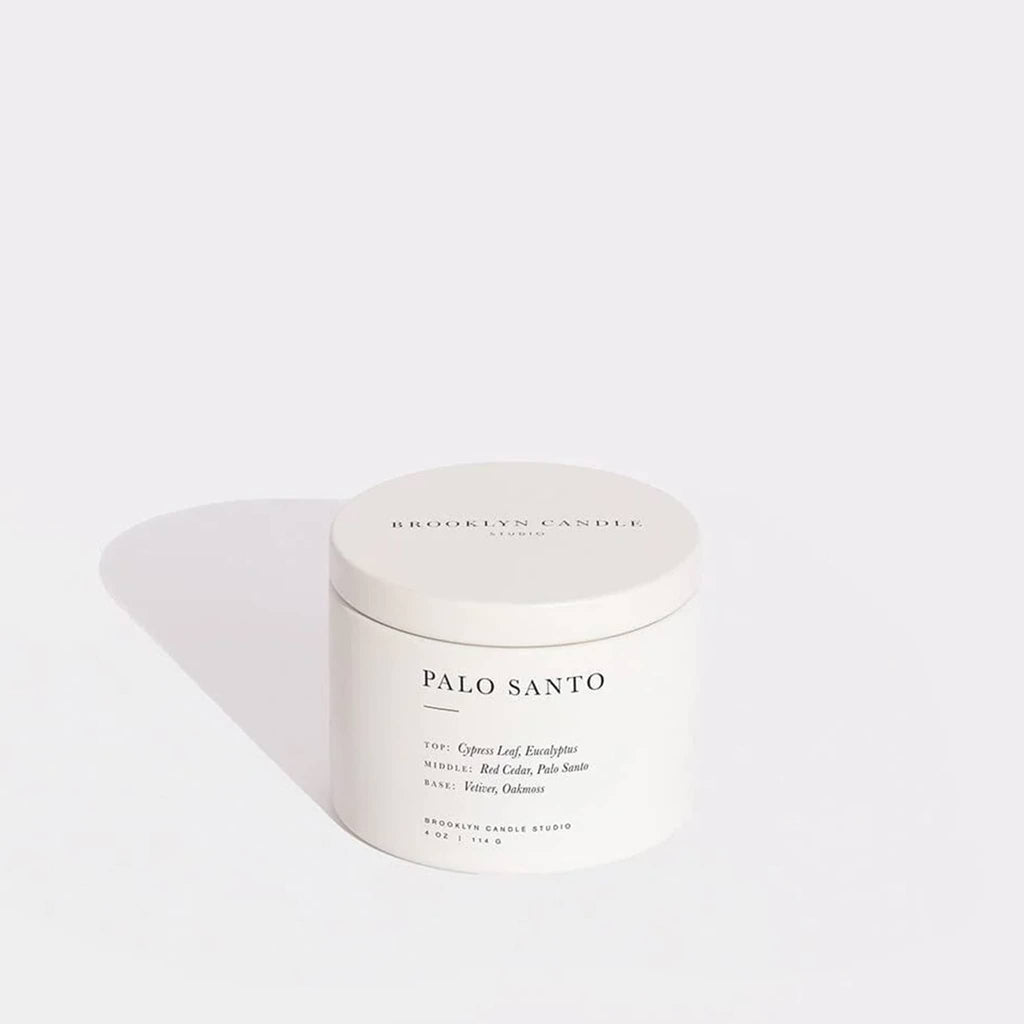Brooklyn Candle Studio Palo Santo candle in white lidded tin on a white background.