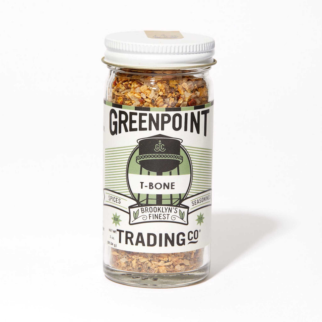 Greenpoint Trading Co T-Bone steak seasoning blend in glass jar, front view.