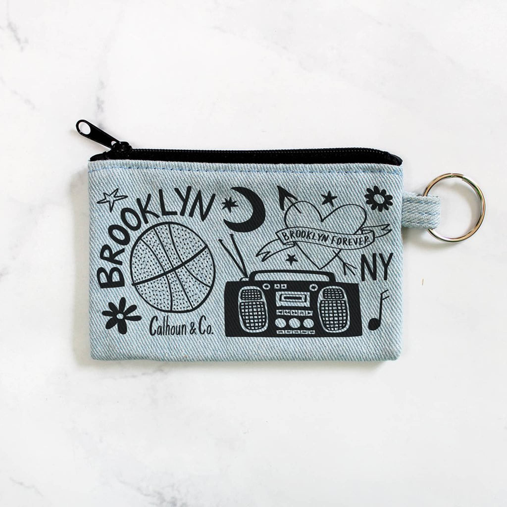 Calhoun and Co Brooklyn light denim zipper card pouch with keyring, front view.