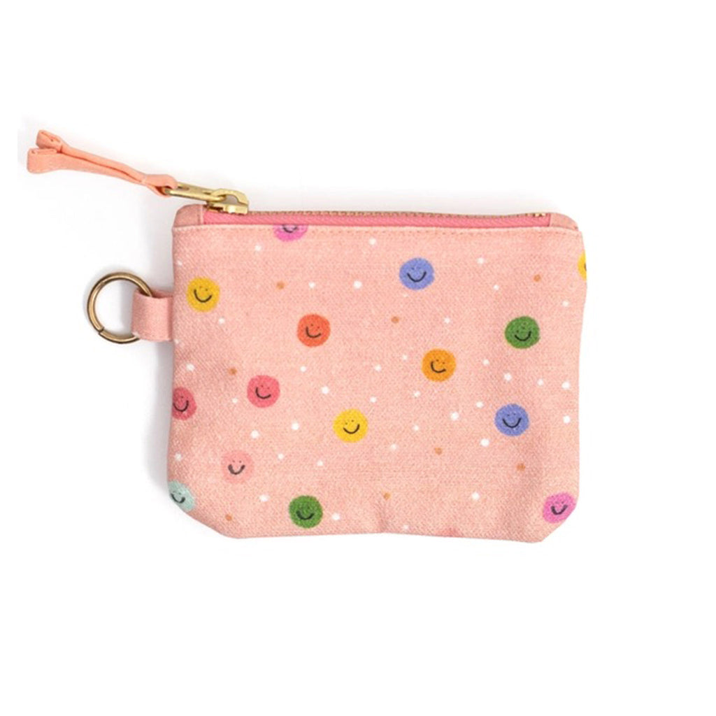 Callie Danielle Happy Day Smiley Canvas ID Wallet, peach fabric has rainbow dots with smiley faces, back view with gold tone top zip and peach zip pull.