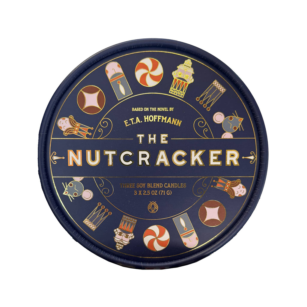 Round packaging for 'The Nutcracker' themed votive candles with illustrations on a dark blue background, top view, on a white background.