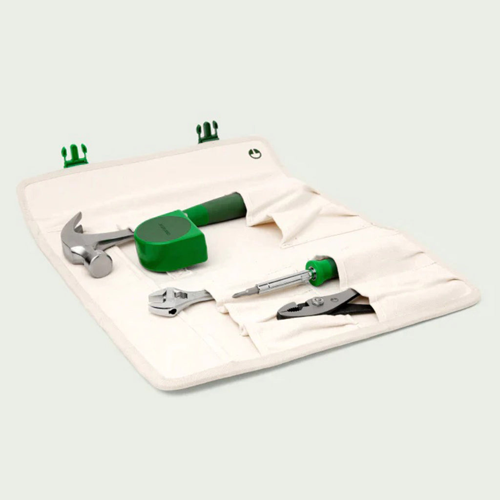 Character "The Go Set" 5 piece tool set with green handles in pockets of the canvas tote lying flat.