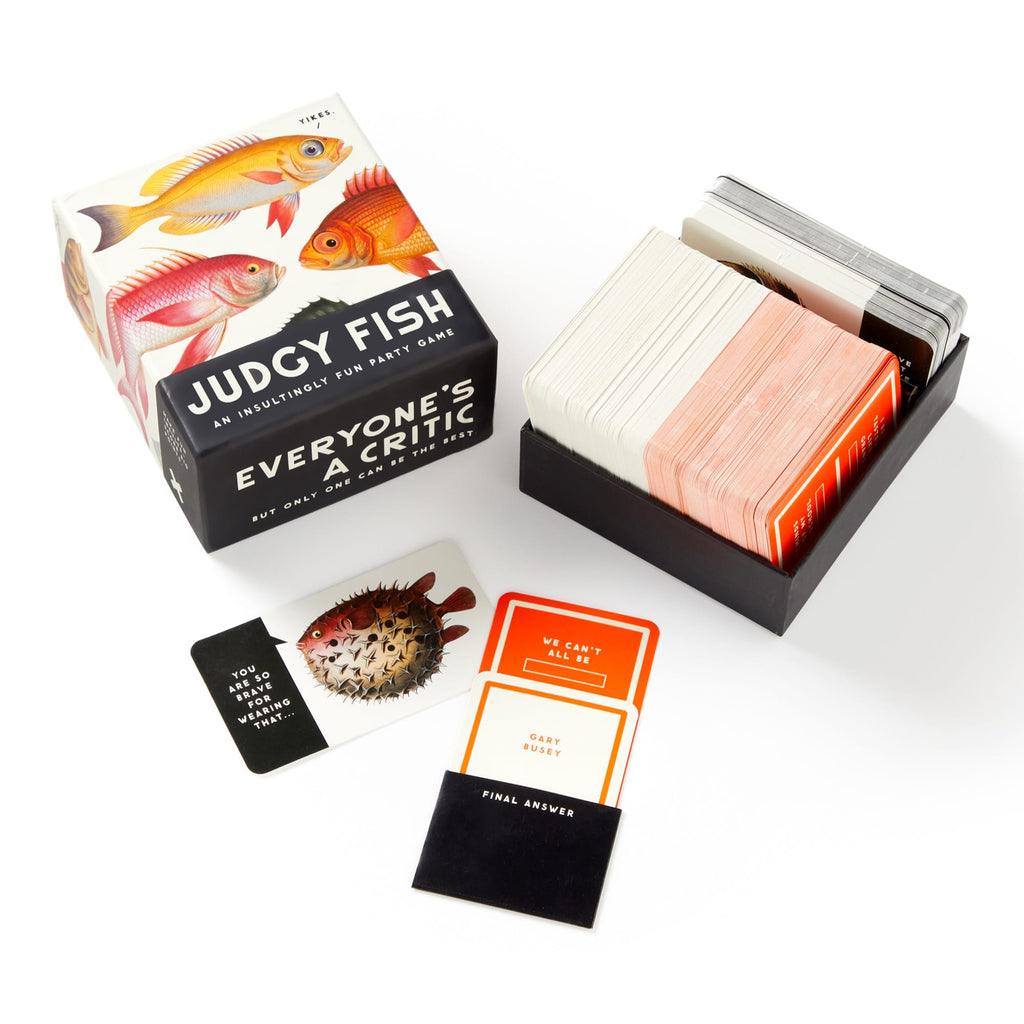 Chronicle Brass Monkey Judgy Fish: an insultingly fun party game, in box packaging, lid off with sample cards shown.