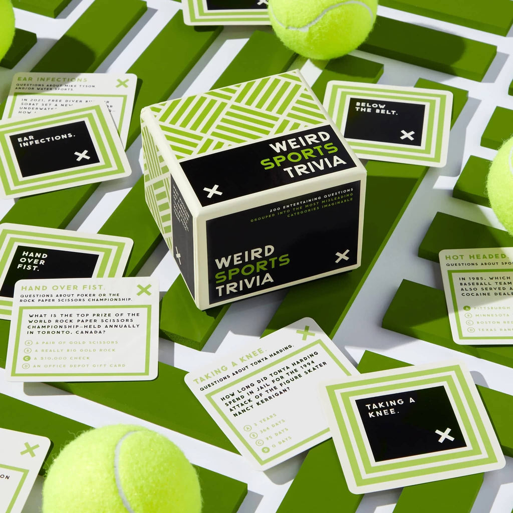 Chronicle Brass Monkey Weird Sports Trivia cards in box packaging with cards and tennis balls scattered around.