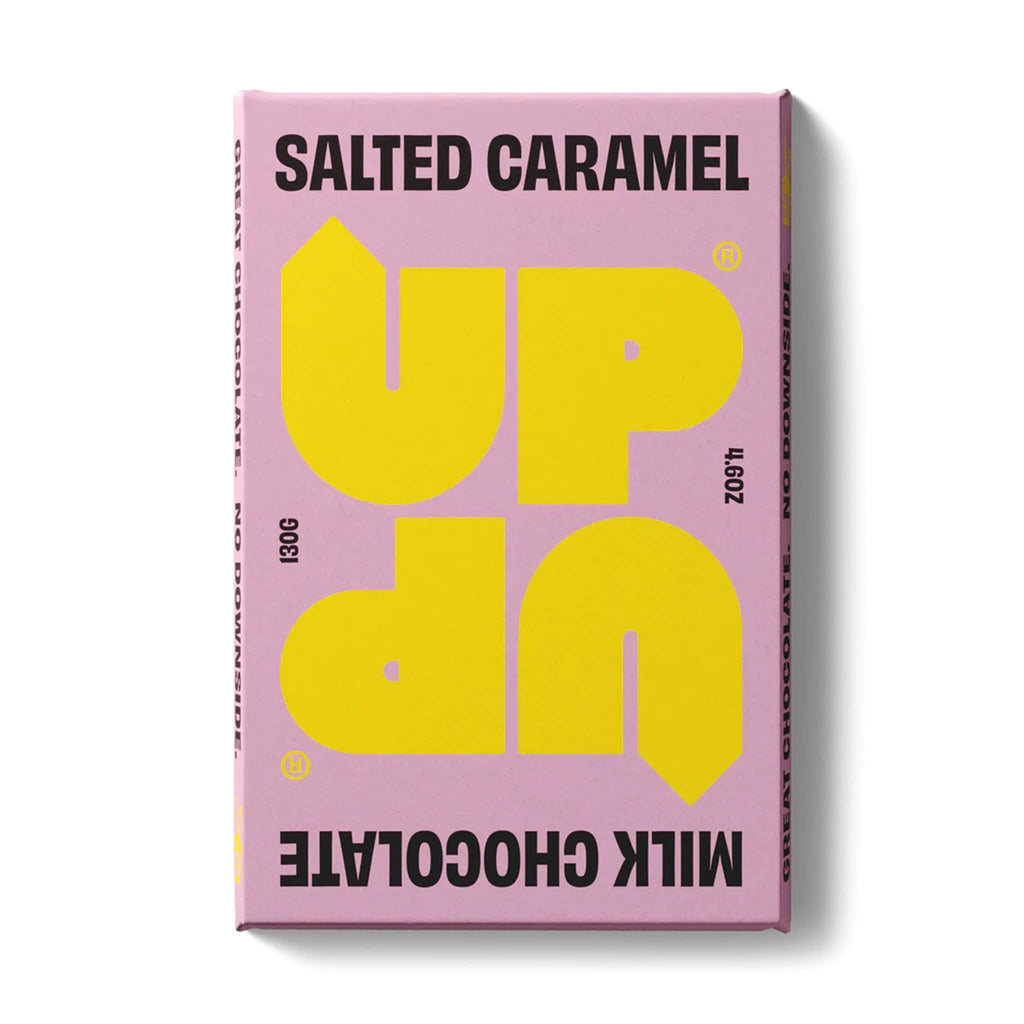 UP-UP 4.6 ounce salted caramel milk chocolate bar in pink wrapper with yellow and black writing, front view.