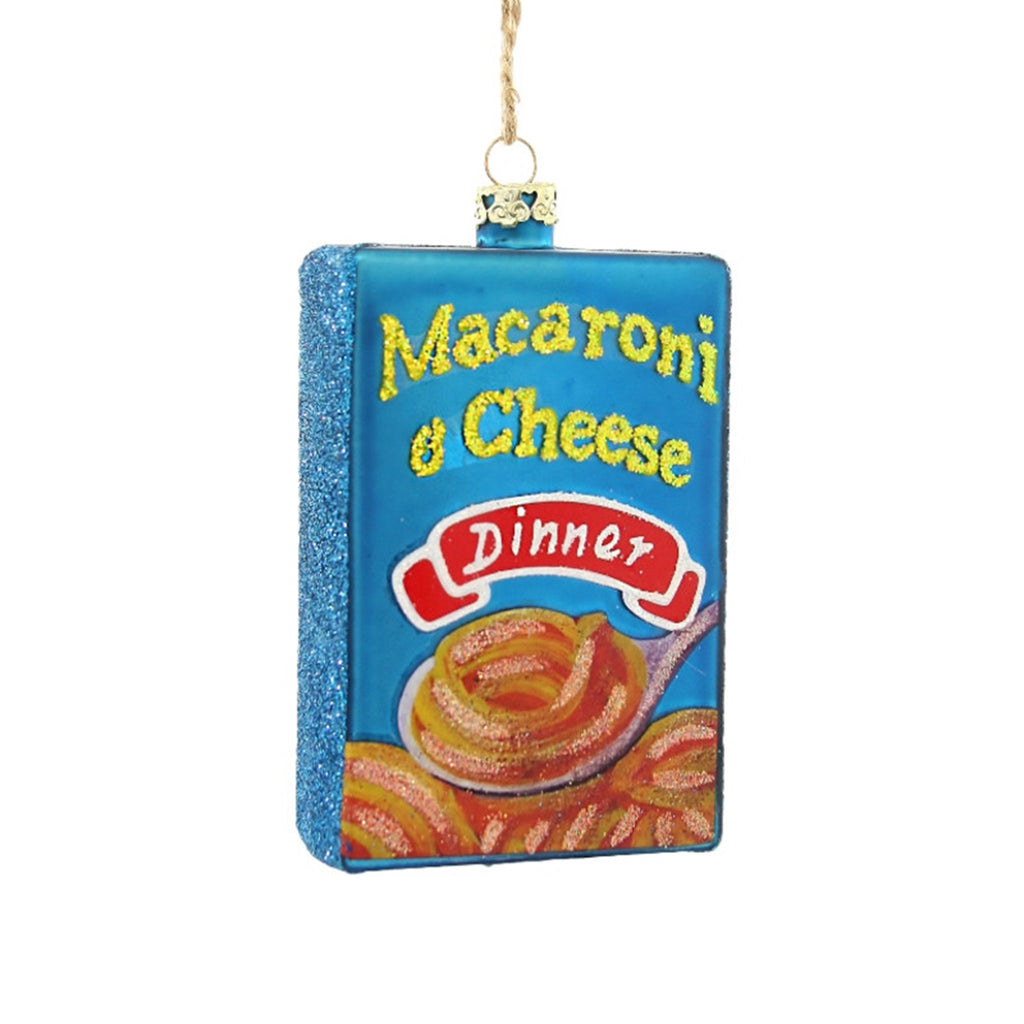 Cody Foster glass holiday tree ornament that looks like a blue box of macaroni & cheese dinner with glitter accents.