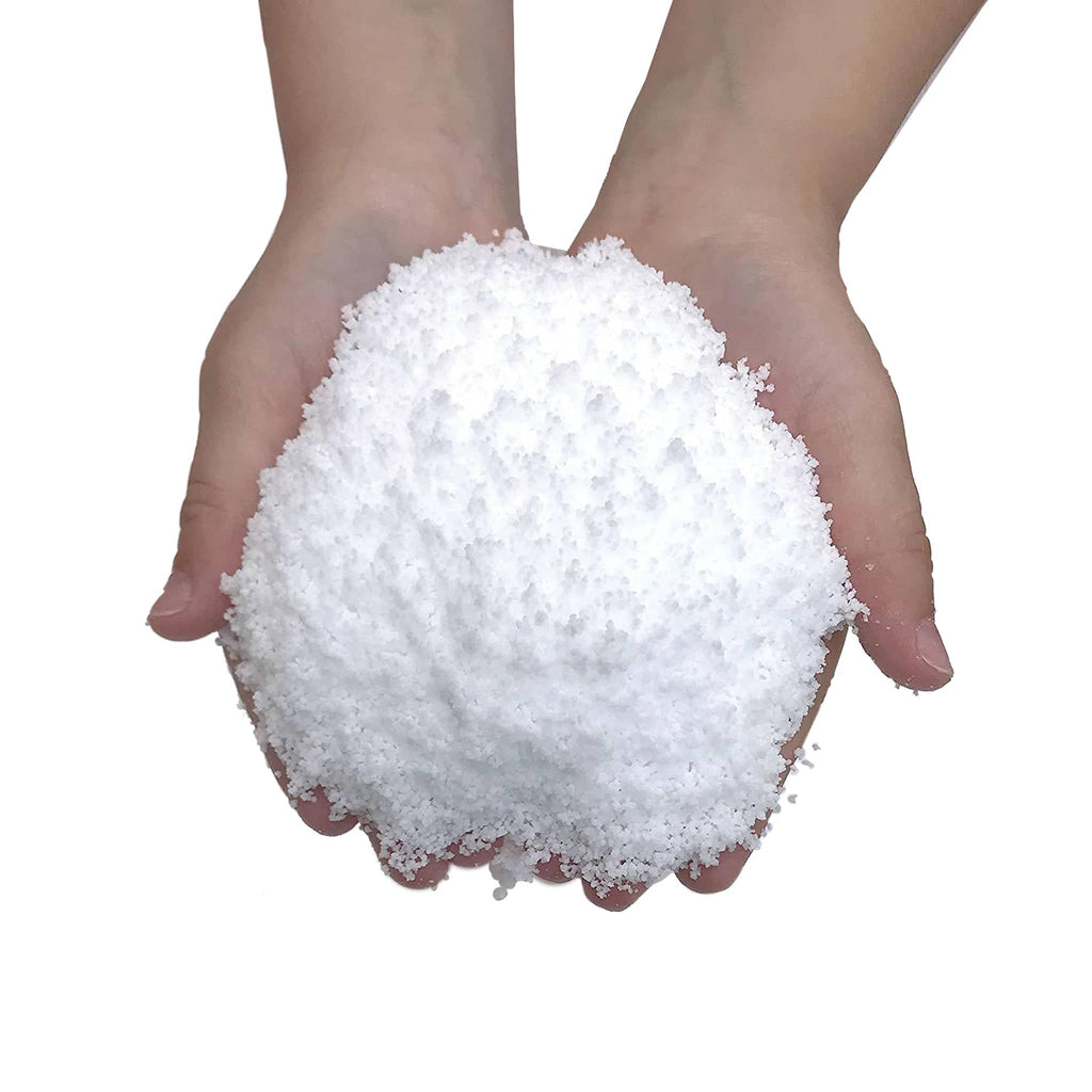 Copernicus Compact Curiosities Instant Winter make your own artificial snow, completed project shown with a pile of "snow" in palm of hands.